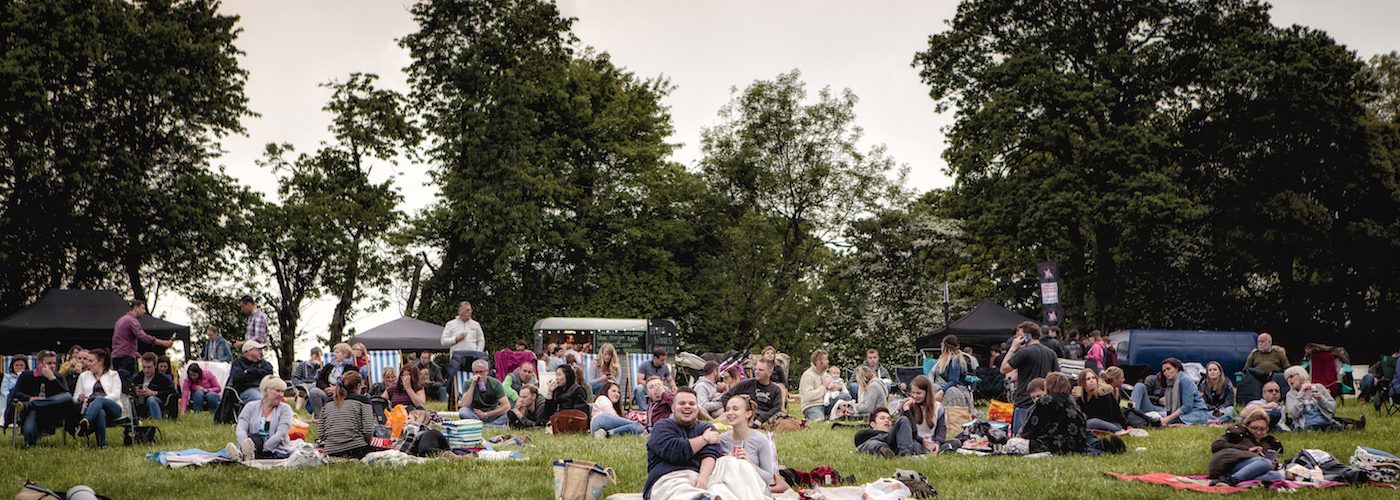 Filmgoers laying on grass