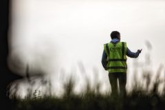 Photograph of an event marshall wearing a high visibility jacket